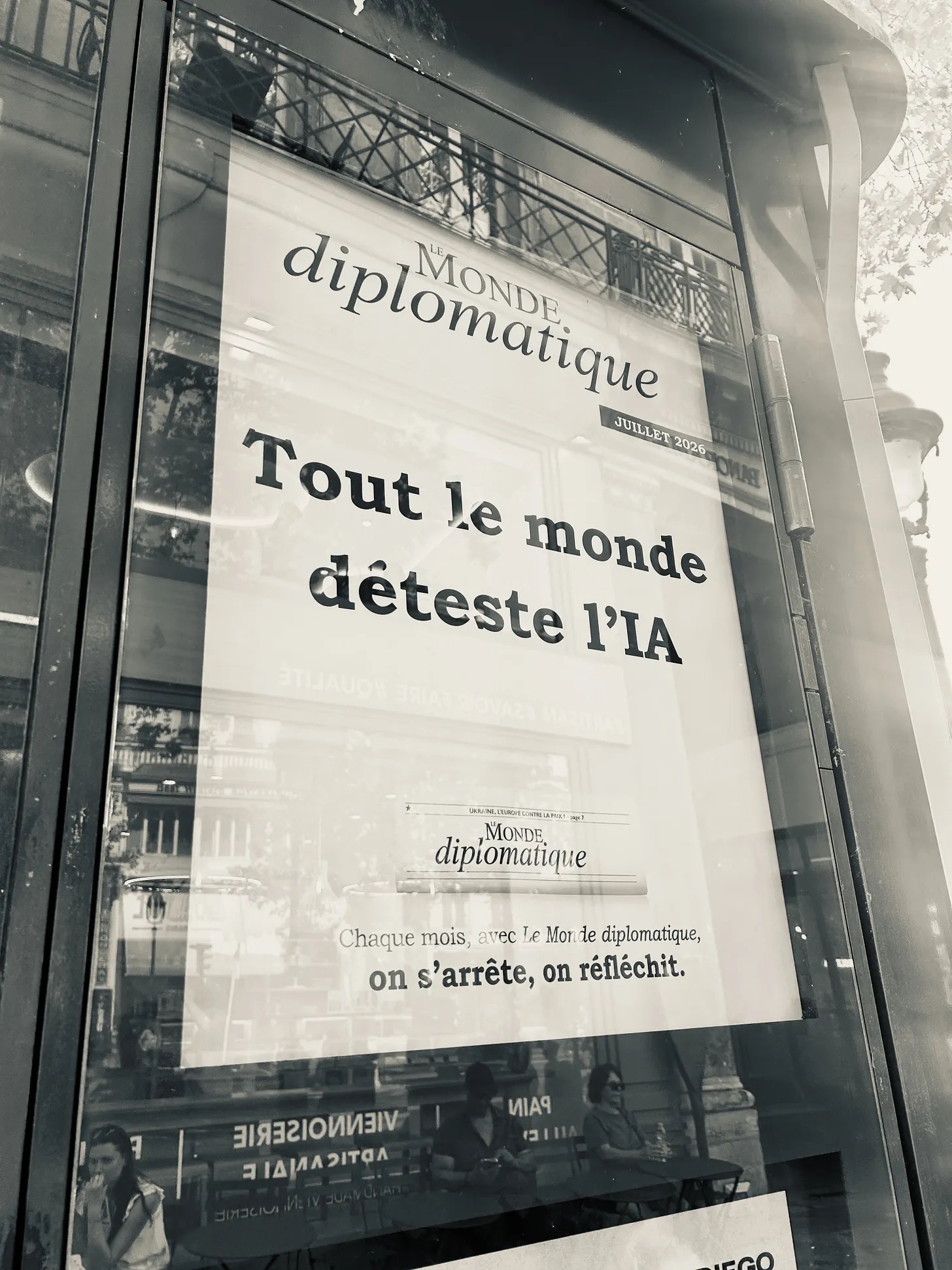 Image credit Brian Merchant A sepia photo of a poster on a Parisian kiosk. It is an ad for Le Monde diplomatique and has the headline “Tout le monde déteste l’IA"