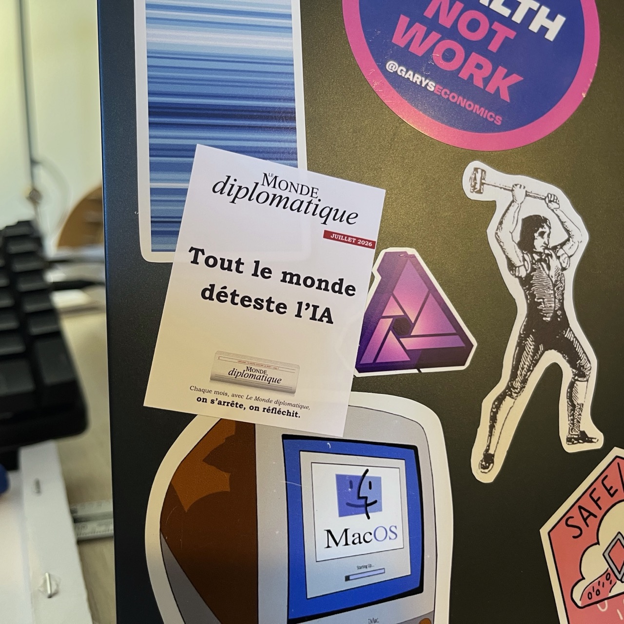 One of those stickers, on my laptop, surrounded by others, such as climate stripes, “tax wealth not work”, and the luddite guy with the hammer